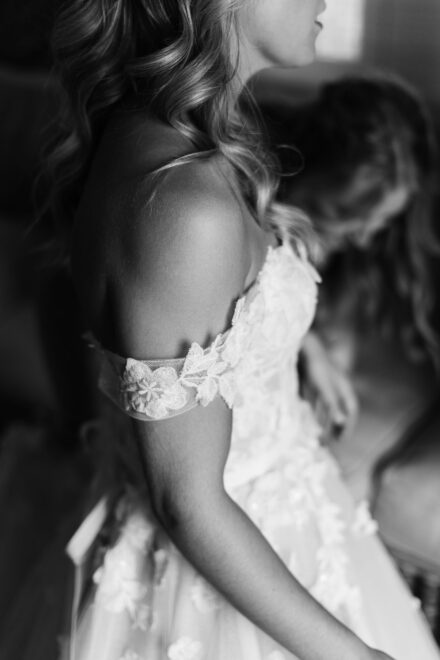 Close-up of bride’s lace wedding dress and shoulder detail at Hacienda Villa Luisa Seville