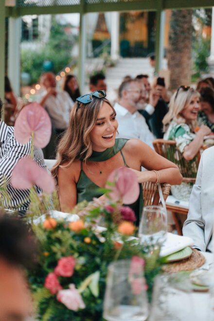 Candid wedding guest moment during dinner in Seville