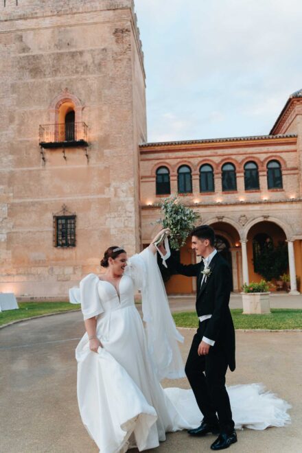 Bride and groom dancing together at Castillo de la Monclova during their wedding in Seville