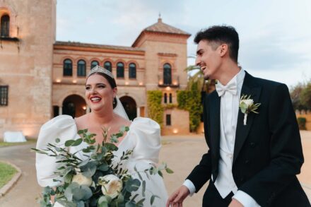 Bride and groom laughing together at Castillo de la Monclova during their wedding in Seville