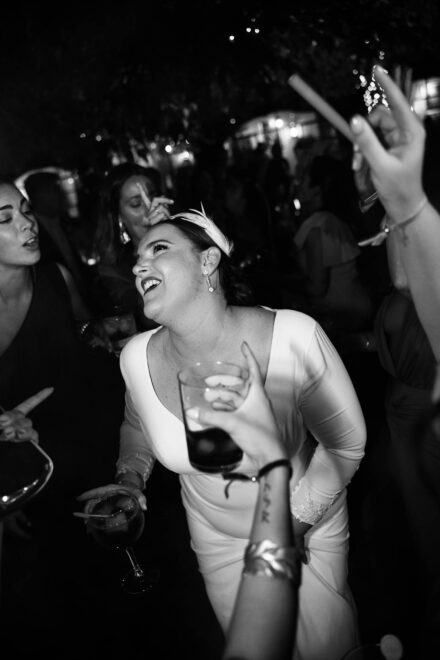 Bride and groom dancing with smoke flare during wedding party at Castillo de la Monclova in Seville