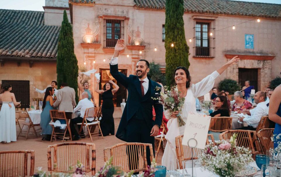 Guests enjoying drinks and conversations at a wedding cocktail in Hacienda Los Molinillos, Seville